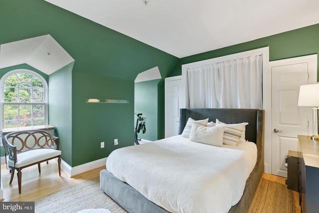 808 Cameron St, Alexandria, VA 22314 - bedroom featuring wood finished floors, vaulted ceiling, and baseboards