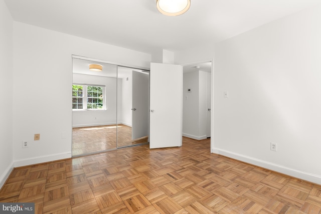 2107 N Taft St Unit 11, Arlington, VA 22201 - unfurnished bedroom featuring baseboards and a closet