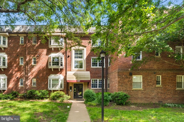 2107 N Taft St Unit 11, Arlington, VA 22201 - view of front of house featuring brick siding and a front lawn