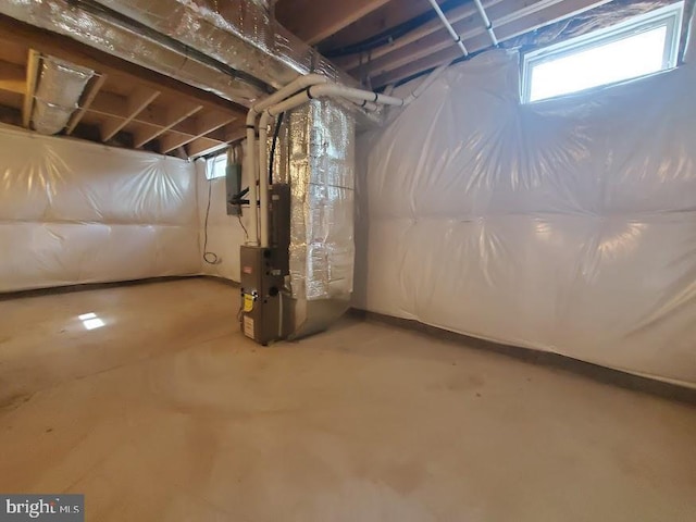 basement featuring heating unit
