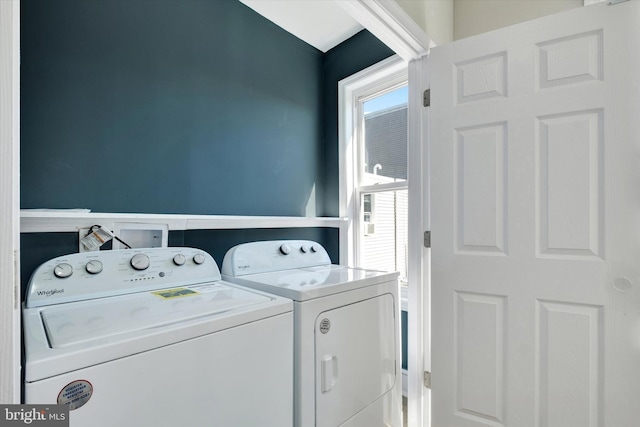 washroom with washer and clothes dryer and laundry area