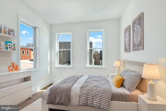 carpeted bedroom with baseboards