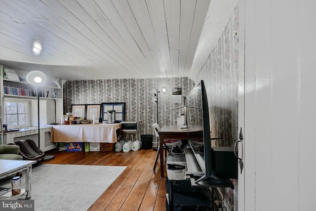bedroom featuring hardwood / wood-style floors and wallpapered walls