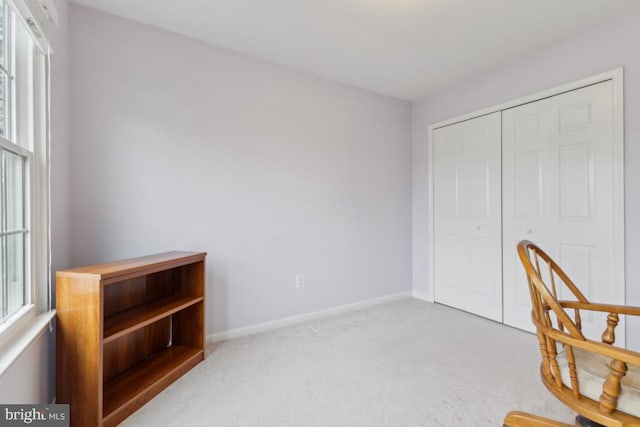 interior space with carpet floors and baseboards