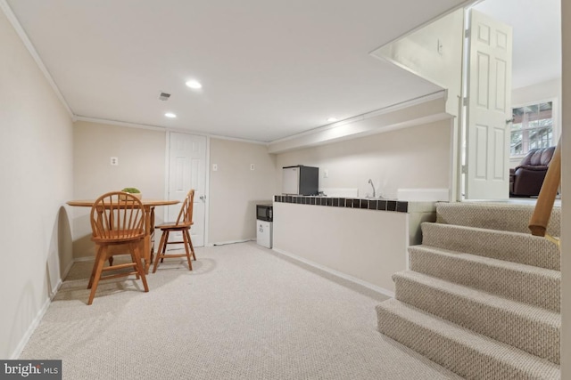 living area featuring stairway, recessed lighting, baseboards, light colored carpet, and ornamental molding