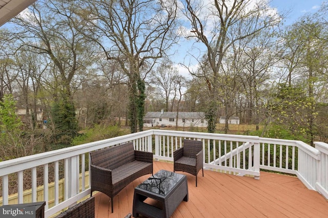 wooden terrace featuring outdoor lounge area