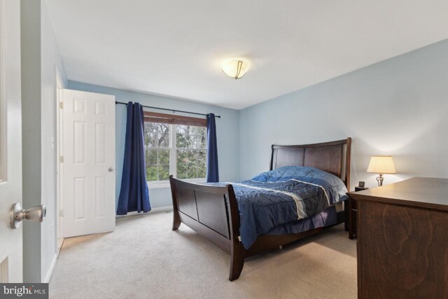 bedroom with light carpet