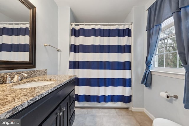 bathroom featuring a shower with curtain, tile patterned floors, vanity, and baseboards
