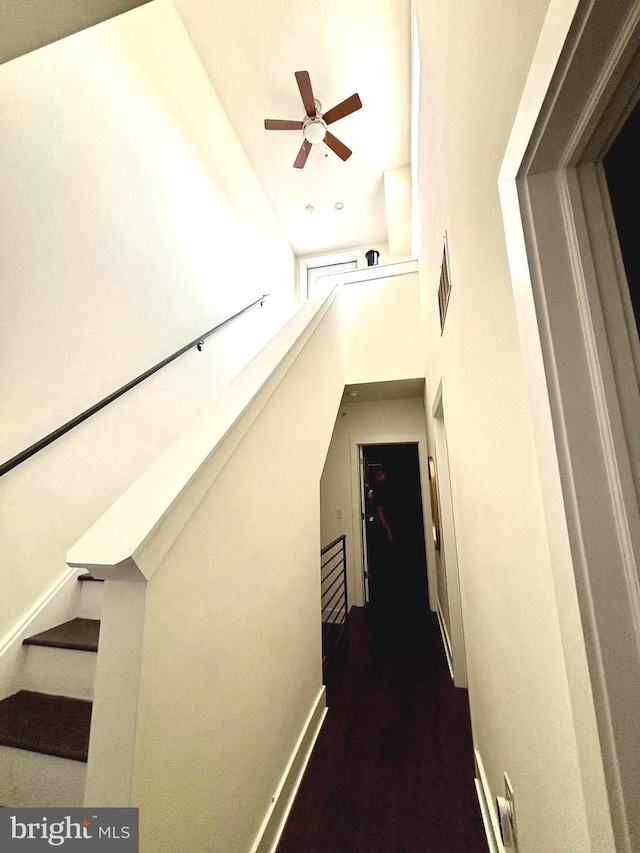 1219 N 5th St Unit 2, Philadelphia, PA 19122 - stairs with ceiling fan, a high ceiling, and baseboards