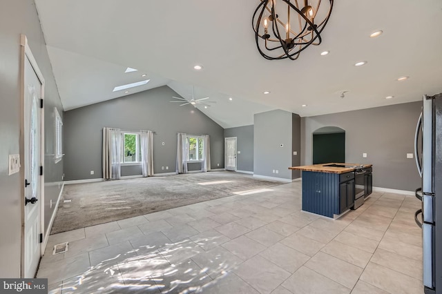 302 Haskell Dr, Arnold, MD 21012 - kitchen featuring freestanding refrigerator, butcher block countertops, arched walkways, baseboards, and recessed lighting