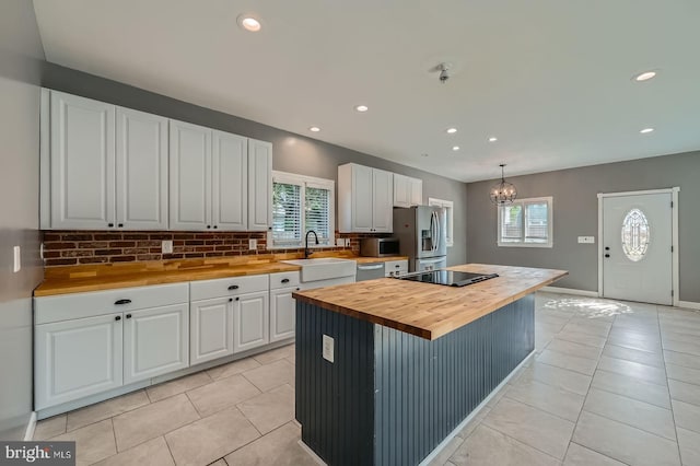 302 Haskell Dr, Arnold, MD 21012 - kitchen featuring wood counters, a sink, white cabinetry, appliances with stainless steel finishes, and light tile patterned floors