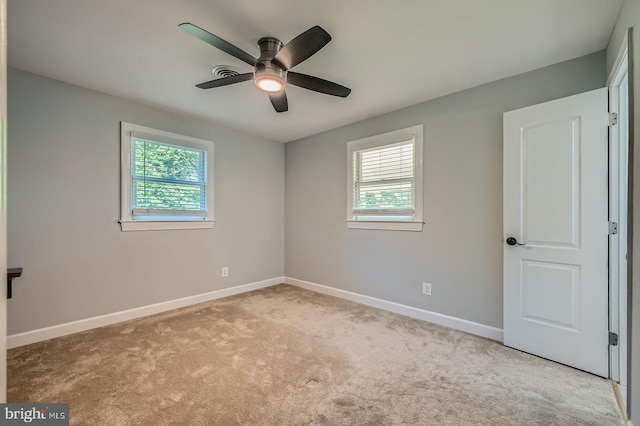 302 Haskell Dr, Arnold, MD 21012 - empty room featuring plenty of natural light, carpet, baseboards, and a ceiling fan
