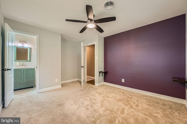 302 Haskell Dr, Arnold, MD 21012 - unfurnished bedroom featuring light carpet, baseboards, connected bathroom, a sink, and ceiling fan