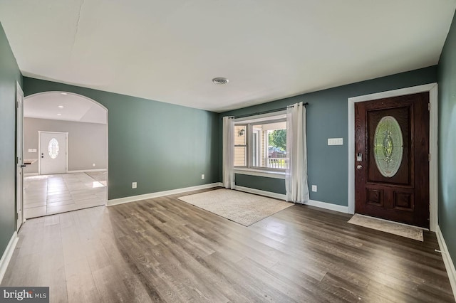 302 Haskell Dr, Arnold, MD 21012 - foyer entrance with wood finished floors, arched walkways, and baseboards