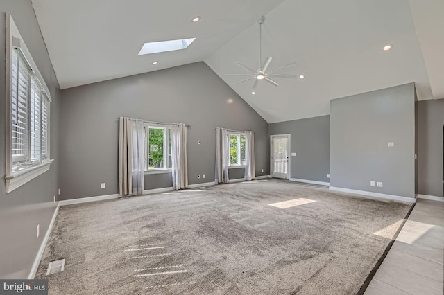 302 Haskell Dr, Arnold, MD 21012 - unfurnished living room featuring a ceiling fan, a skylight, high vaulted ceiling, baseboards, and recessed lighting