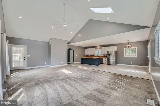302 Haskell Dr, Arnold, MD 21012 - unfurnished living room with high vaulted ceiling, light colored carpet, a ceiling fan, baseboards, and recessed lighting