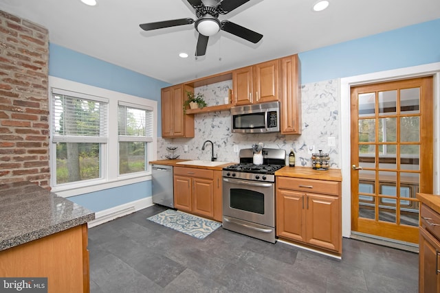 kitchen featuring recessed lighting, backsplash, open shelves, a sink, and appliances with stainless steel finishes