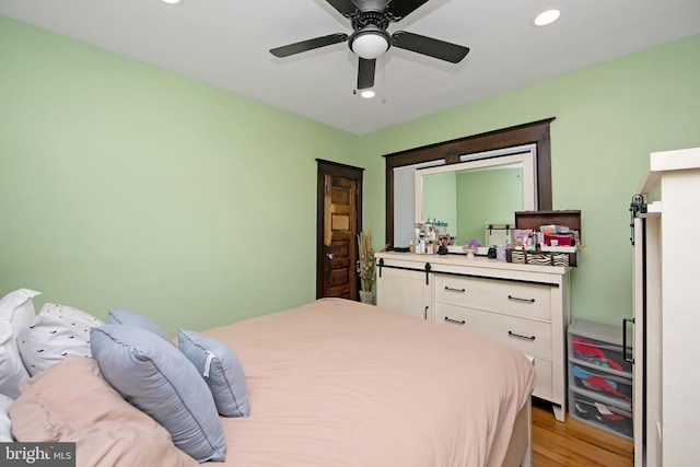 bedroom featuring recessed lighting, light wood finished floors, and ceiling fan