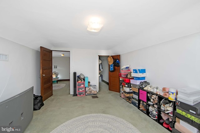 rec room with lofted ceiling and carpet floors