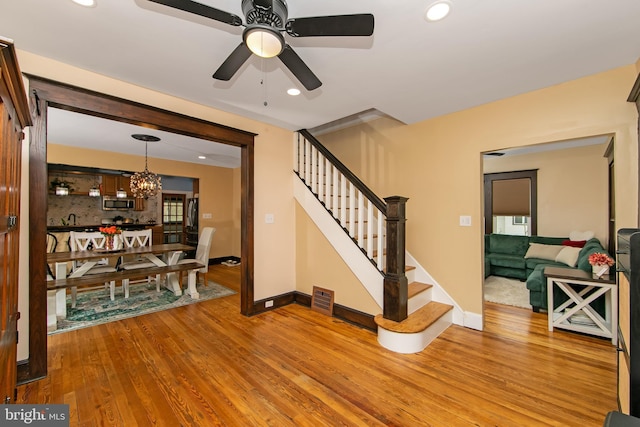 living area with recessed lighting, stairs, visible vents, and light wood-style flooring