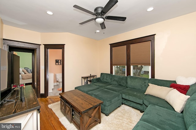 living area with recessed lighting, wood finished floors, and a ceiling fan