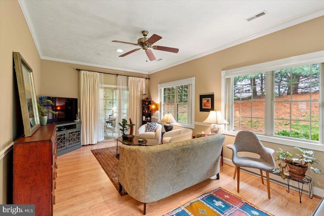 13113 Little Hayden Cir Unit 87, Hagerstown, MD 21742 - living room with light wood-style floors, visible vents, a ceiling fan, and ornamental molding
