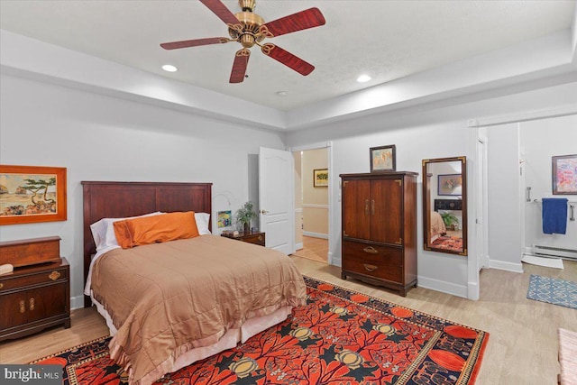 13113 Little Hayden Cir Unit 87, Hagerstown, MD 21742 - bedroom with baseboards, ceiling fan, light wood-type flooring, recessed lighting, and a baseboard heating unit