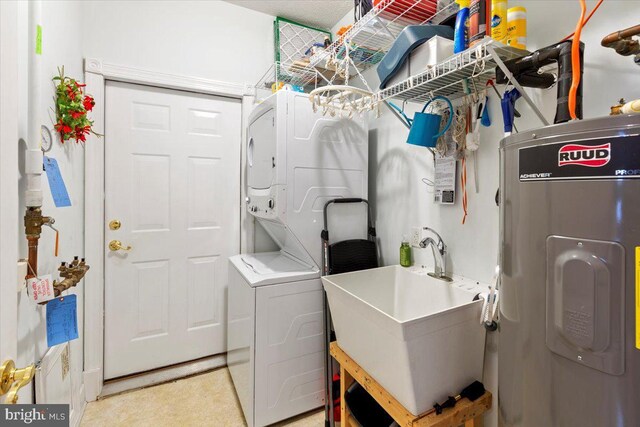 13113 Little Hayden Cir Unit 87, Hagerstown, MD 21742 - clothes washing area featuring stacked washer / dryer, laundry area, a sink, and electric water heater
