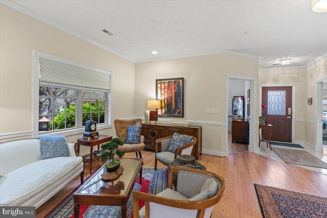 13113 Little Hayden Cir Unit 87, Hagerstown, MD 21742 - living area with wood finished floors, ornamental molding, visible vents, and recessed lighting