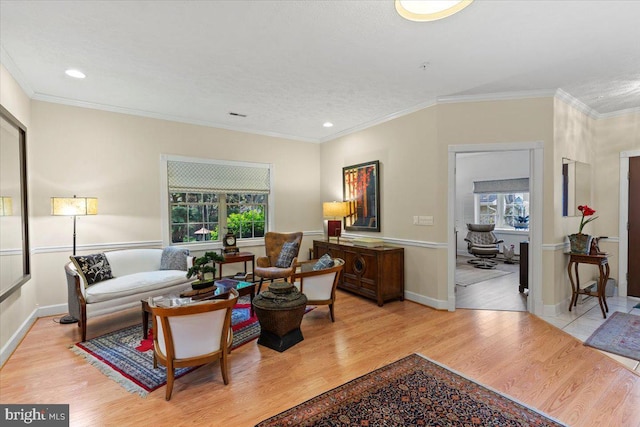 13113 Little Hayden Cir Unit 87, Hagerstown, MD 21742 - living area featuring a wealth of natural light, light wood-style flooring, and crown molding