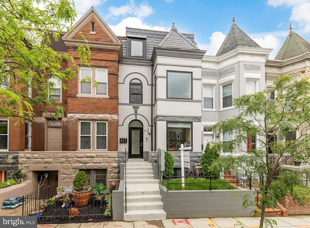 41 Q St NE Unit 2, Washington, DC 20002 - view of property featuring a fenced front yard and brick siding