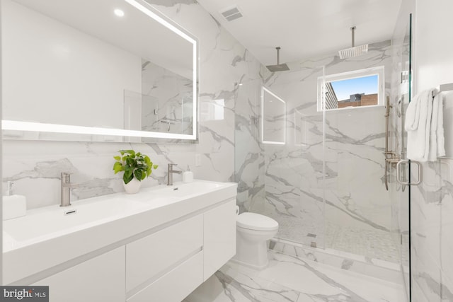 41 Q St NE Unit 2, Washington, DC 20002 - bathroom with marble tiled flooring, a marble finish shower, double vanity, toilet, and tile walls