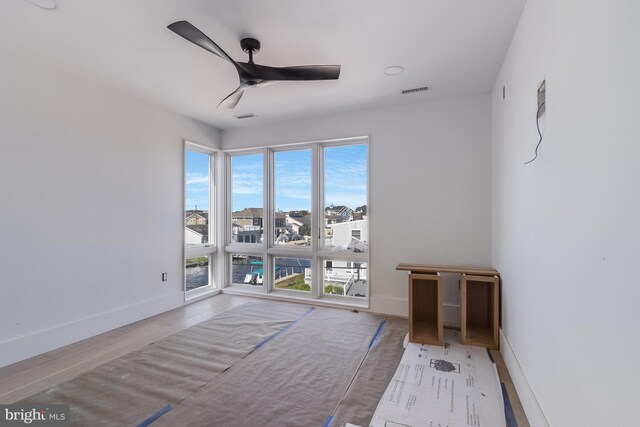 318 York Rd, South Bethany, DE 19930 - unfurnished room with ceiling fan, baseboards, and wood finished floors