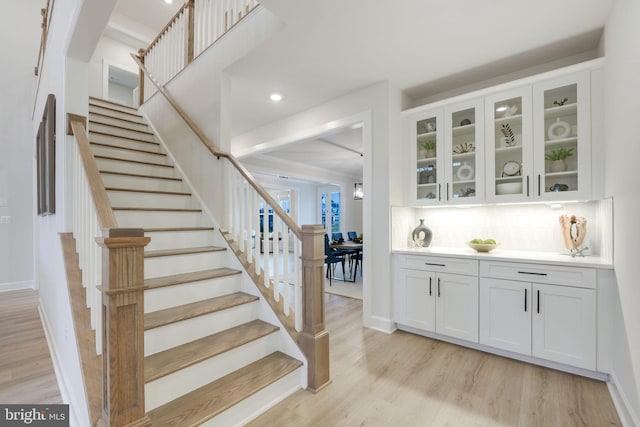 interior space featuring recessed lighting, baseboards, and wood finished floors