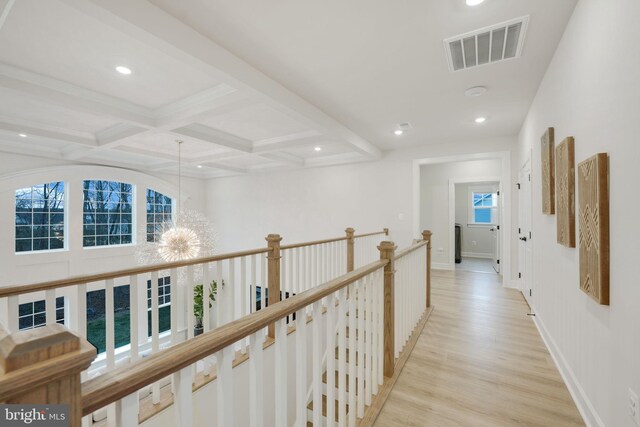 corridor featuring recessed lighting, light wood-style flooring, visible vents, beamed ceiling, and coffered ceiling