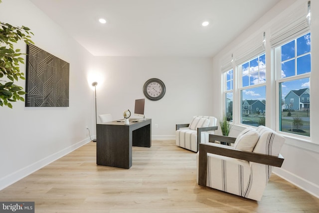 office space with baseboards, light wood-type flooring, and recessed lighting