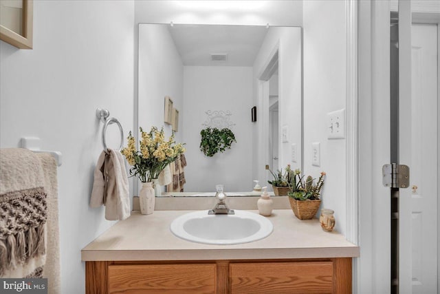 bathroom with visible vents and vanity