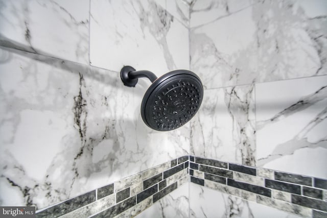 room details with a marble finish shower