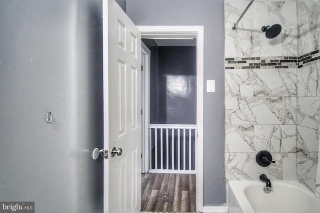 full bathroom featuring wood finished floors and shower / tub combination