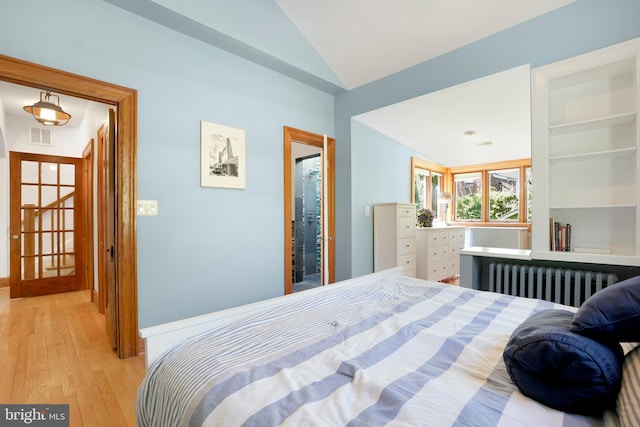 7812 Takoma Ave, Takoma Park, MD 20912 - bedroom with radiator, vaulted ceiling, and light wood finished floors