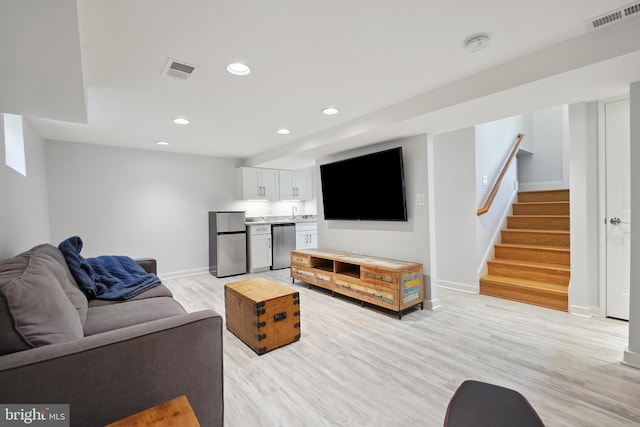 7812 Takoma Ave, Takoma Park, MD 20912 - living room with baseboards, stairs, recessed lighting, light wood-style floors, and bar area