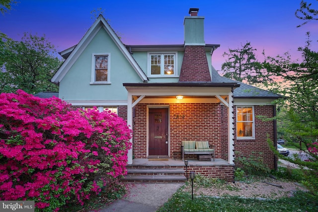 7812 Takoma Ave, Takoma Park, MD 20912 - view of front of house with a chimney, brick siding, and stucco siding