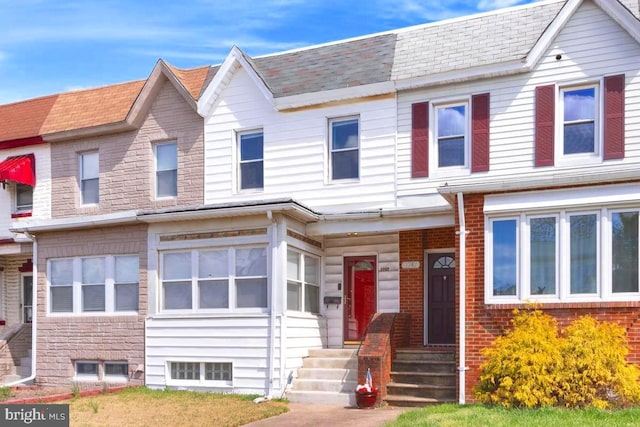 1745 Portship, Dundalk, MD 21222 - multi unit property featuring a shingled roof, brick siding, and entry steps