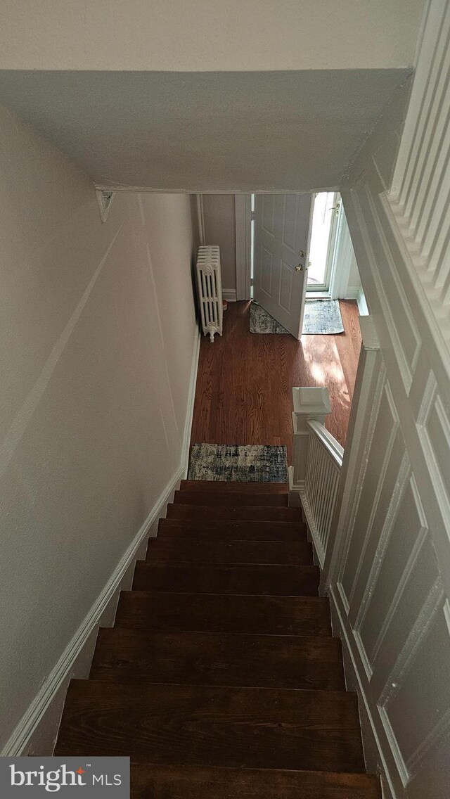 3563 Holmead Pl NW, Washington, DC 20010 - staircase with vaulted ceiling and wood finished floors