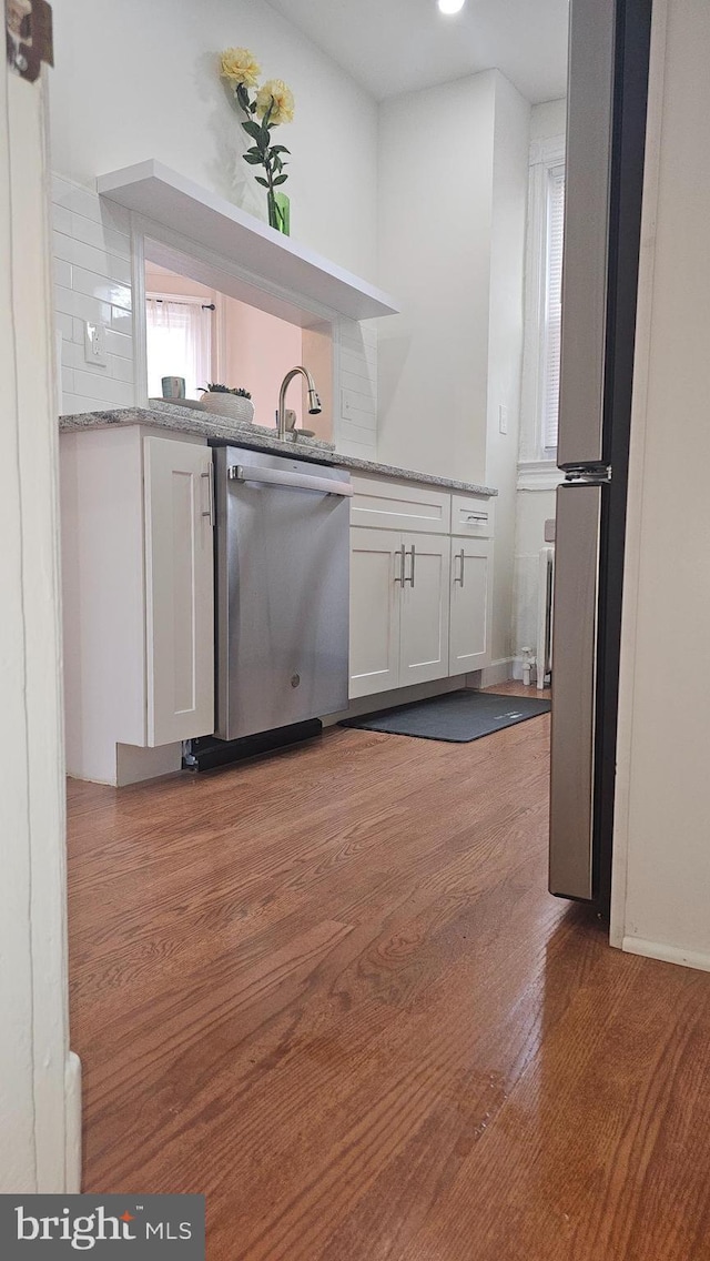 3563 Holmead Pl NW, Washington, DC 20010 - kitchen featuring open shelves, white cabinetry, backsplash, wood finished floors, and stainless steel dishwasher