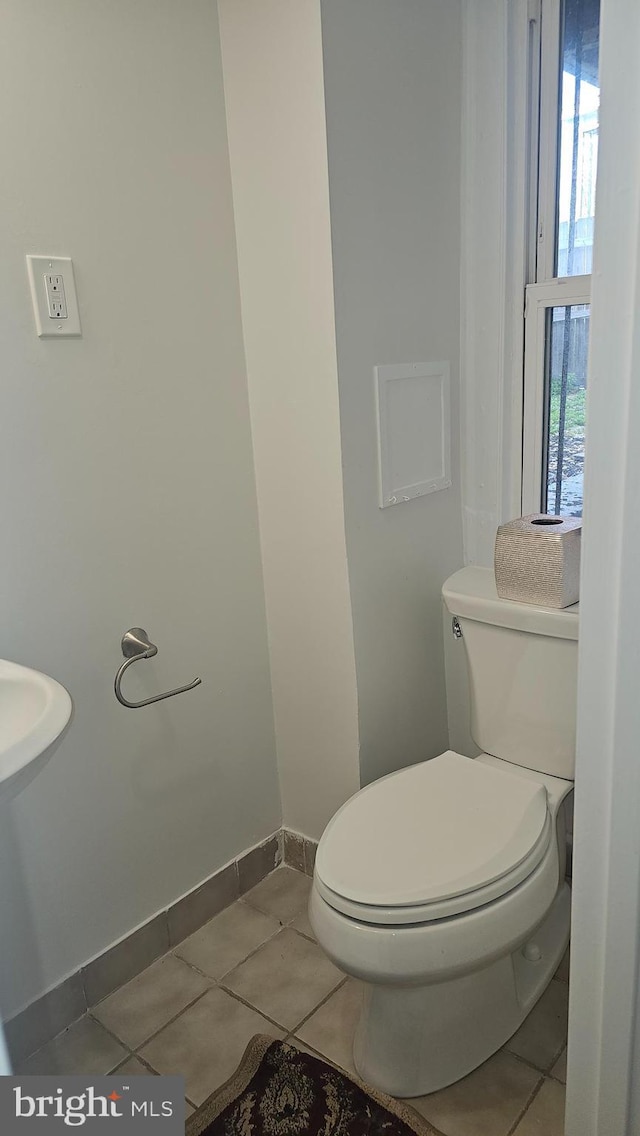 3563 Holmead Pl NW, Washington, DC 20010 - half bath featuring toilet, baseboards, and tile patterned flooring