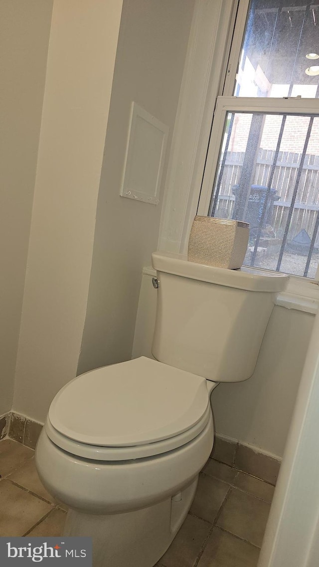 3563 Holmead Pl NW, Washington, DC 20010 - bathroom featuring baseboards, tile patterned flooring, and toilet