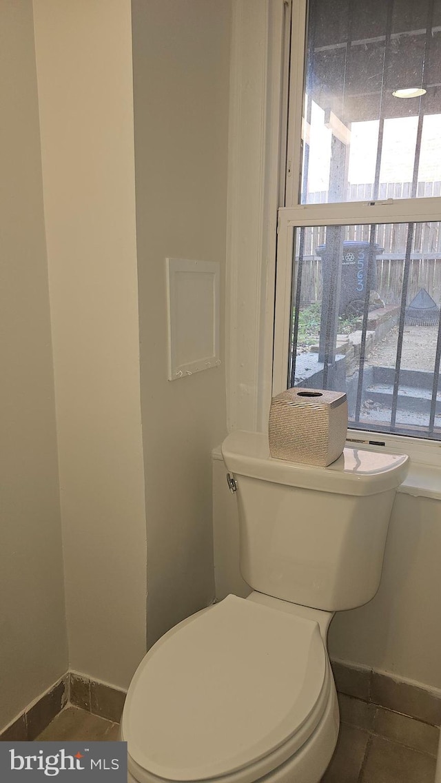3563 Holmead Pl NW, Washington, DC 20010 - bathroom with toilet, baseboards, and tile patterned flooring