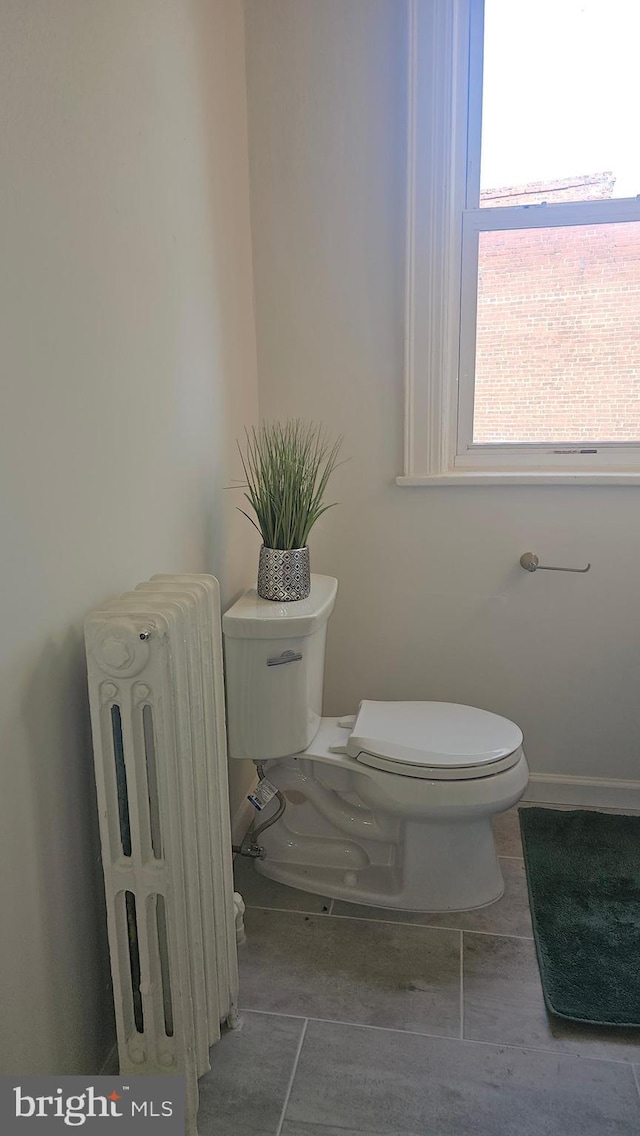 3563 Holmead Pl NW, Washington, DC 20010 - half bath with toilet, baseboards, and radiator heating unit