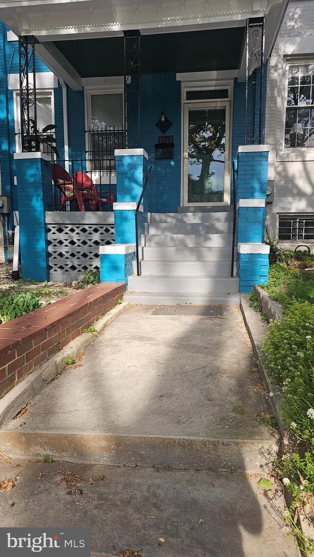 3563 Holmead Pl NW, Washington, DC 20010 - property entrance with a porch and brick siding